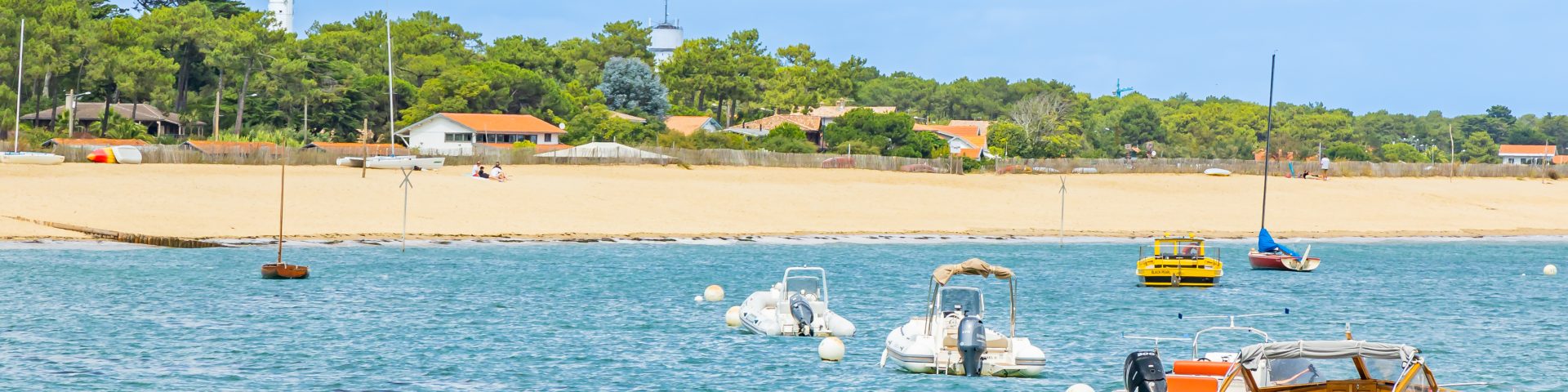 The lighthouse and beach at Cap Ferret on a sunny day in Arcachon Bay, France
