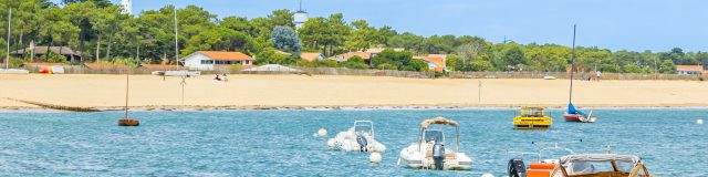The lighthouse and beach at Cap Ferret on a sunny day in Arcachon Bay, France